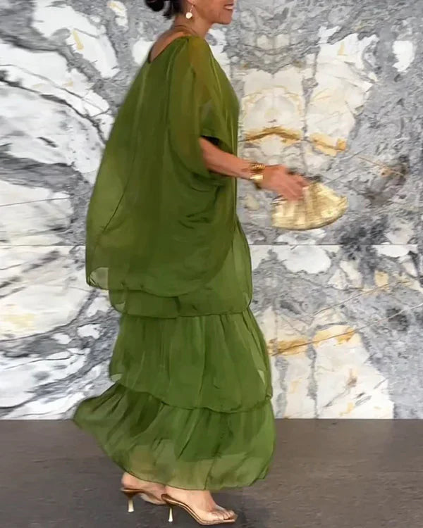 Ermeløs lang kjole i chiffon med dolman erme og rund utringning